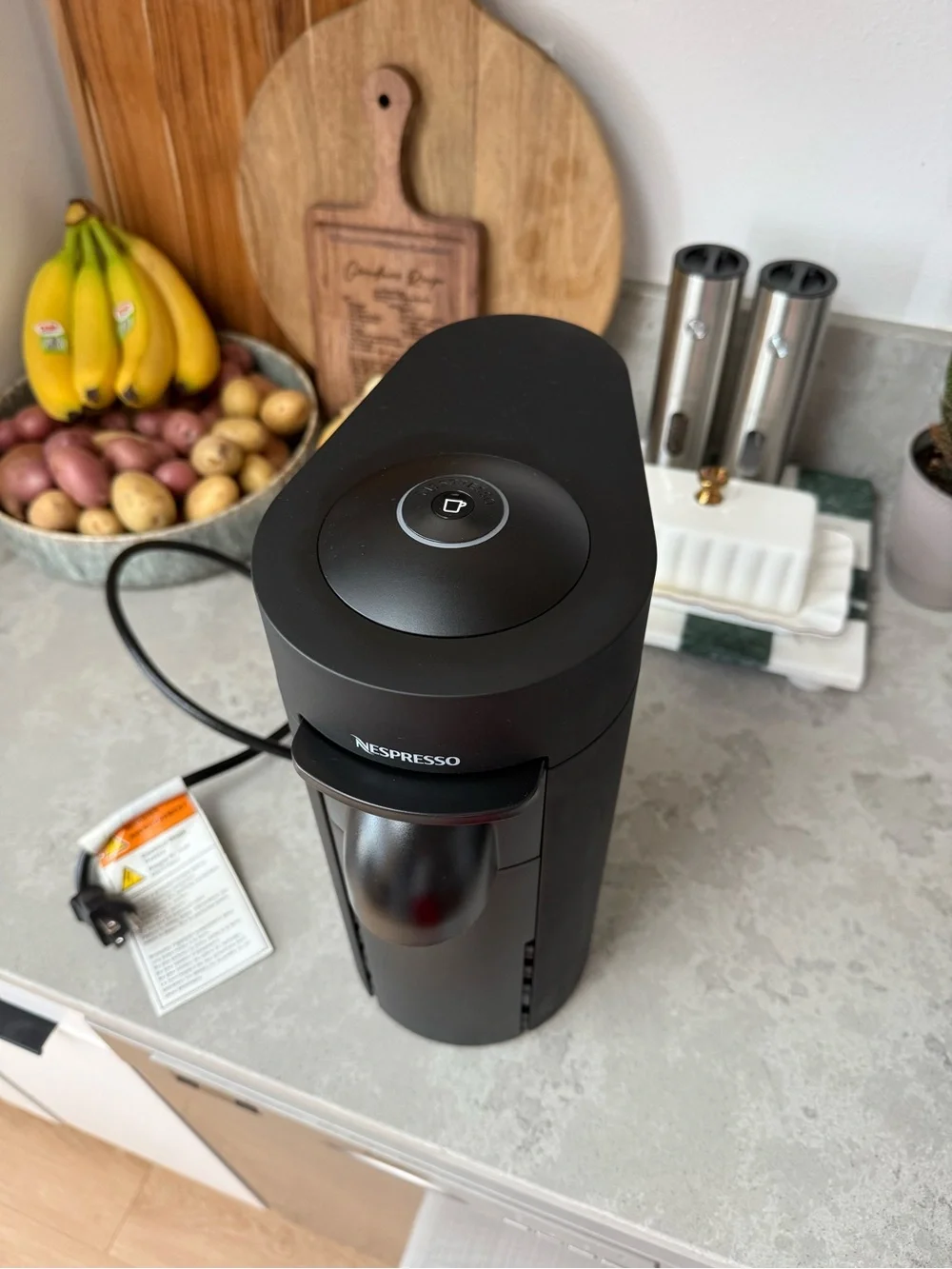 Nespresso VertuoPlus Coffee & Espresso Machine in Black with Gold Capsules
